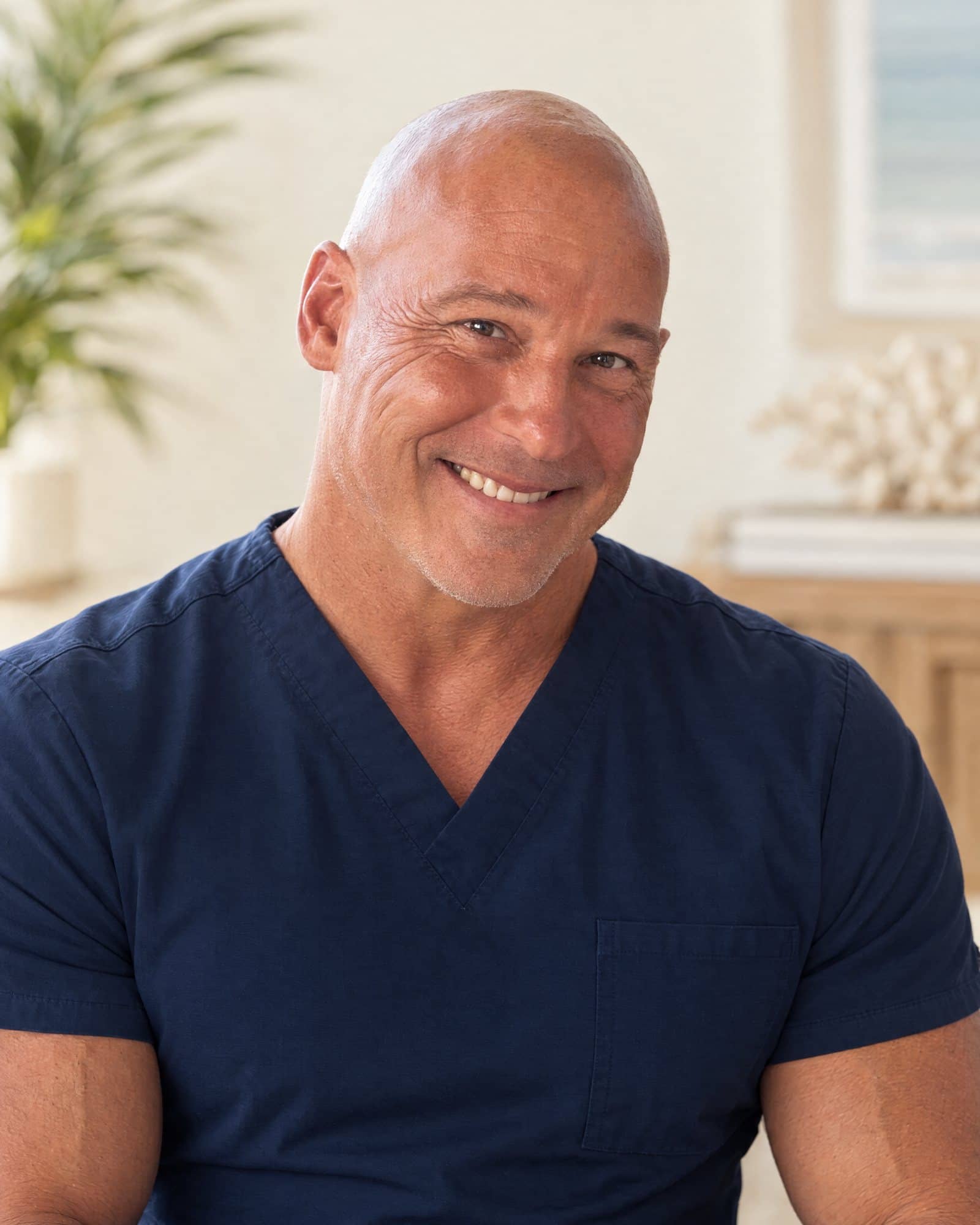 Portrait of Dr. Robert Losier, DPM, in navy scrubs